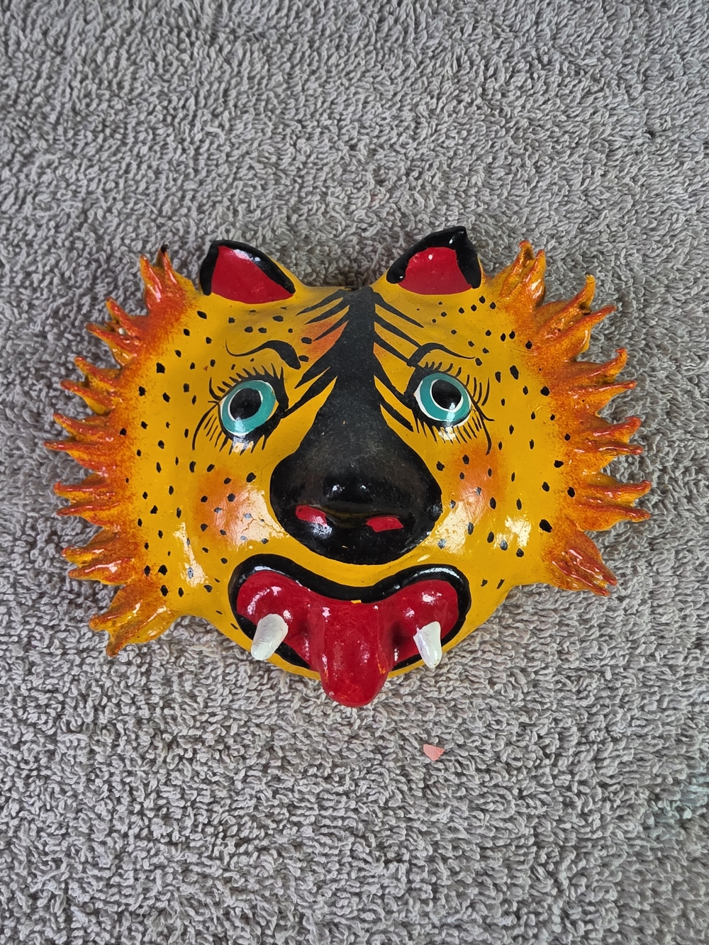 Hand-Painted Coconut Shell Yellow Sun Face Wall Art with Red Tongue